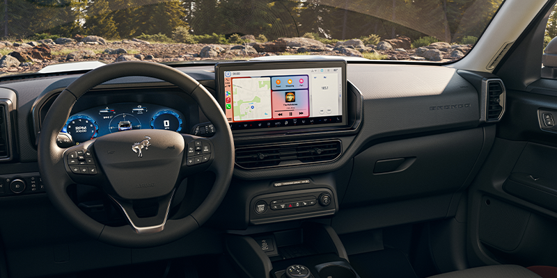 The interior of a Ford vehicle showcasing the dashboard and touchscreen interface.